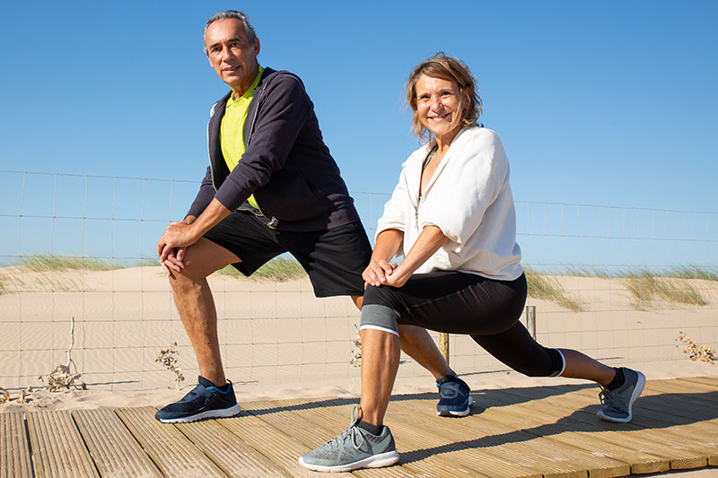 Happy couple celebrating fitness success